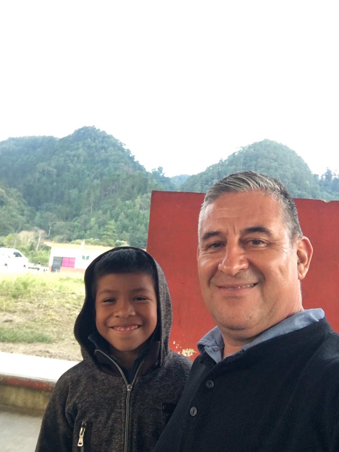 Angel Romero with the smiling boy who was healed
